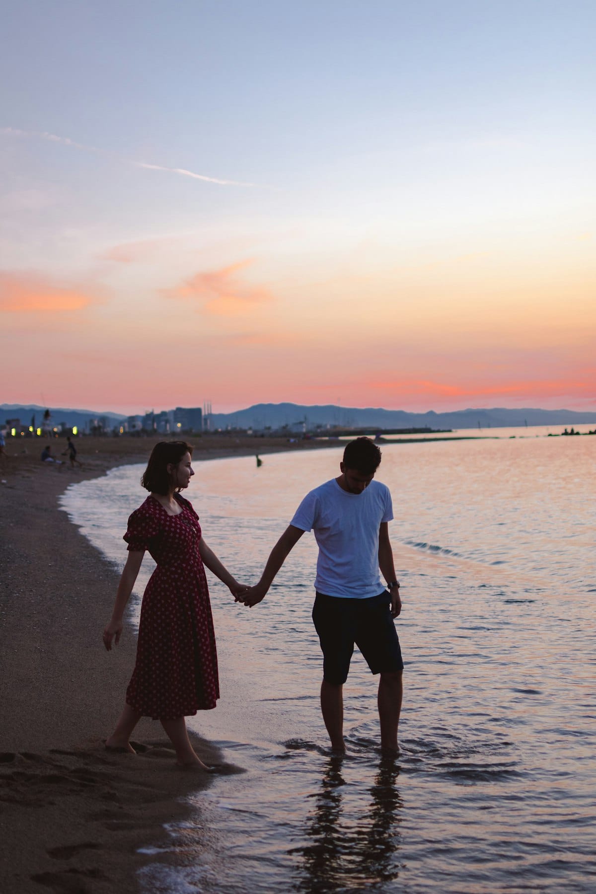 A couple walking together at golden hour after a date